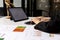 Hands of business woman typing on a tablet keyboard, she is using a messaging program to talk to a business partner who is opening