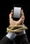 Hands of businessman addicted to mobile phone rope bond wrists in smartphone internet addiction