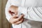 Hands of a businessman, closeup, button sleeves on a shirt