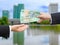 Hands of businessman passing Australian dollar banknote.