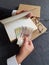 hands of a businessman with peruvian money and books on the table