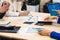 Hands of businesspeople working at desk in office