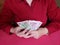 hands of a businesswoman holding singaporean banknotes