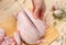 Hands butchering the chicken. Hands of a woman with a knife