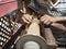 Hands of carpenter turning wood on lathe