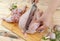 Hands carve up raw chicken before cooking dinner.
