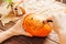 Hands carving with knife a pumpkin to Halloween decoration.