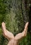 Hands catching clean falling water close up