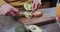 Hands of caucasian man preparing avocado toast in kitchen, slow motion