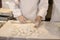 Hands of chefs making dough for grilled rice dumplings in Chinatown in Kobe in Japan