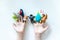 Hands of a child with finger puppets, toys, dolls close up on white background - playing puppet theatre and children entertainment