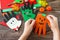 In the hands of a child Greeting card halloween on wooden table. Childrens creativity project.