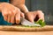 Hands chopping parsley leaves, closeup