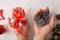 Hands with christmas gift and coal reward concept for behavior