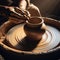 Hands for clay pot on potters wheel, in artist studio