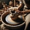 Hands for clay pot on potters wheel, in artist studio