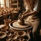 Hands for clay pot on potters wheel, in artist studio