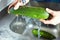 Hands cleaning courgette