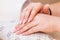 Hands close-up in a beauty salon on a manicure. Background, selective focus