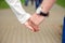 Hands closeup of a loving couple, romance, love, jeans. Concept idyll