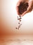 Hands with coffee beans