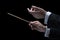 Hands of conductor with baton