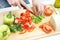 Hands cooking vegetables salad