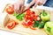 Hands cooking vegetables salad