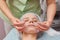 Hands of cosmetician, collagen mask.