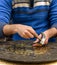 Hands of Craftsman Engraving Brass Plate