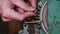 Hands of a Craftsman Working on an Abrasive Wheel in a Workshop