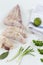 Hands cuting monkfish slices on a white background