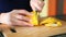 Hands cutting lemon
