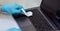 Hands Disinfecting Laptop Wearing Medical Gloves At Home, Closeup, Panorama