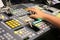 Hands on dissolve of Switcher buttons in studio TV station, Audi