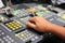 Hands on dissolve of Switcher buttons in studio TV station, Audi