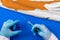 Hands of doctor holding syringe and coronavirus COVID-19 vial vaccine on flag Cyprus