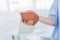 Hands of a doctor and nurse shaking hands