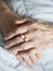 Hands of elderly lady with golden ring-series of photos