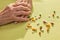 Hands of an elderly lady with medication