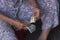 Hands of an elderly woman counting the paper bills