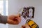 The hands of an electrician installing a power switch