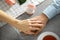 Hands of engaged young couple sitting in cafe