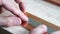 hands of engineer prepare copper bars for drill. metalworking industry: close up hole drilling in copper bars for