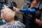 The hands experienced employee girl barbershop, dry hair hairdryer woman\\\'s client close-up salon