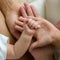 Hands of the family- baby, son, mother and father. Concept of family, unity, protection, support and happiness.