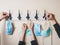 Hands of a family hanging their protective masks on a coat hanger, going out after quarantined concept