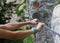 hands of the female climber while holding tightly to the steel r