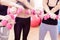 Hands of Five Female Athletes Standing Together