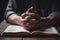 Hands folded in prayer on a Holy Bible in church concept for faith AI generated